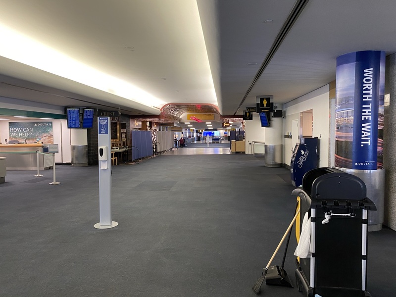 This is a picture taken of a deserted airport terminal. 