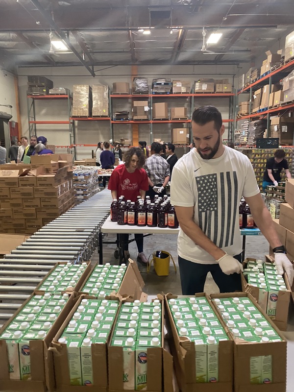 People working in a warehouse.