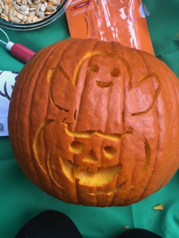 Orange pumpkin carved with ghost for Halloween.