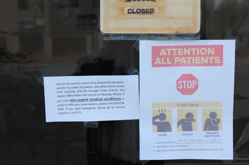 three signs.
The first sign says: "closed." 
The second sign says: "Due to the current coronavirus pneumonia pandemic and for the safety of patients, this office will be closed from Saturday 3/21/20 through Friday 4//3/20. The regular office hours will resume on Monday 4/6/20. If you have non-urgent medical conditions or need to refill your prescription, please contact (516)728-5030. If you have emergency, please go to nearest hospital or call 911."
The third sign is to all patients and has a stop sign on it and states that if someone has a cough, fever, or trouble breathing to call (516)728-5030 or 911, tell whomever you call your answers and ask where to go and what you should do. 