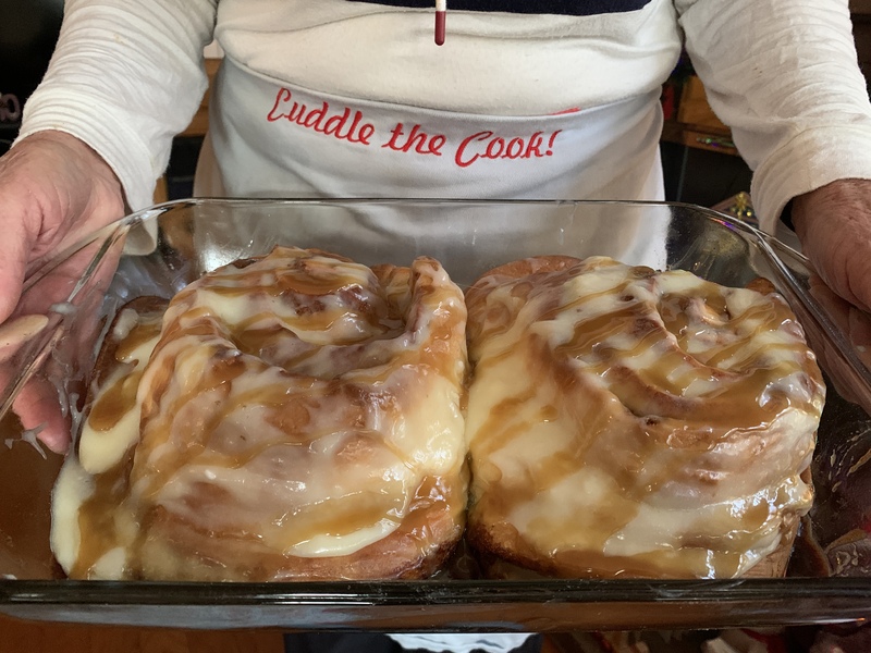 Glass pan with cinnamon rolls.