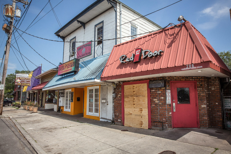 Businesses along Carrollton Avenue in New Orleans, LA, boarded shut.