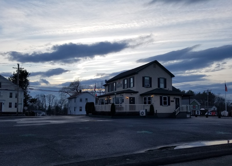 An empty lot next to a pub.