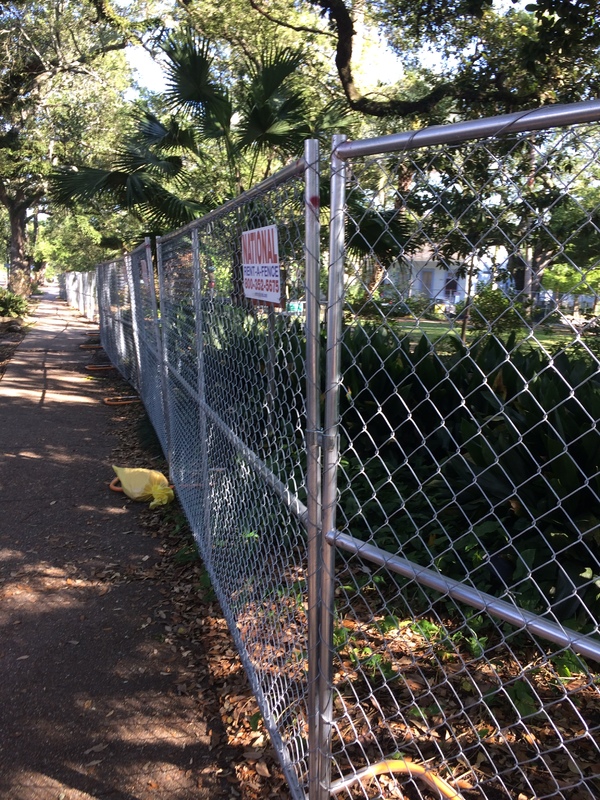 A chain fence in a park. 