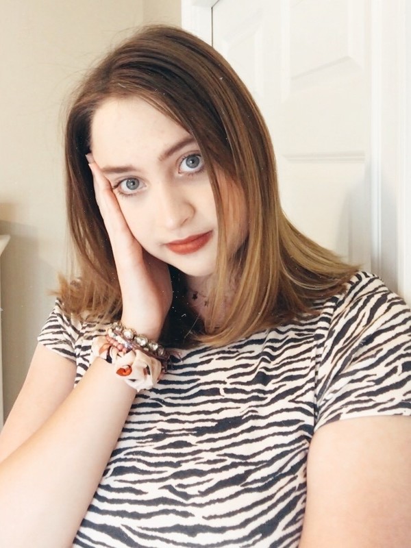 A person in a zebra print t-shirt. 