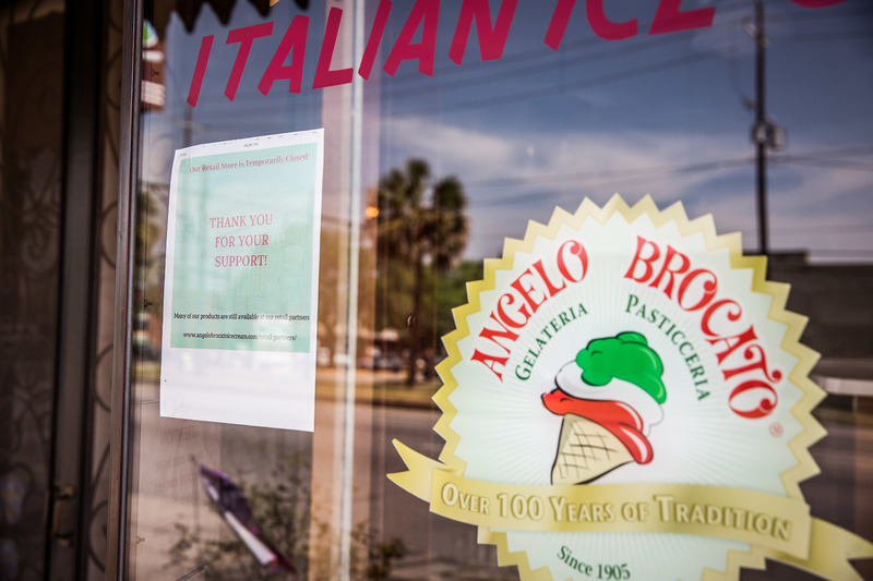 A closed sign is posted in the front window of Angelo Brocato’s Gelateria in New Orleans, LA.