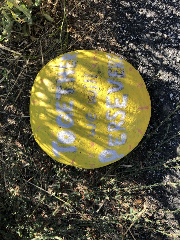 This is a picture of a rock that has been painted yellow.