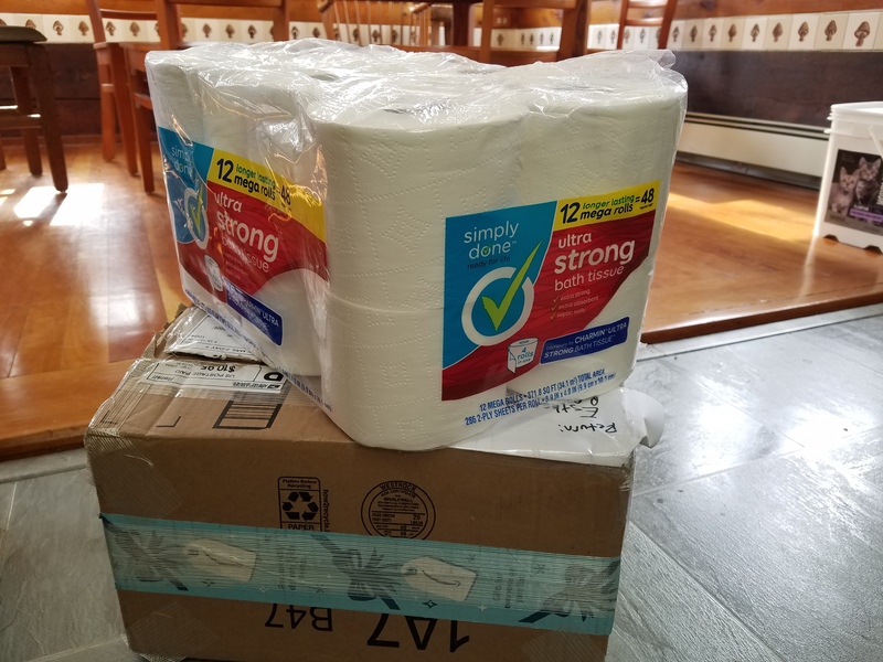 Toilet paper sitting atop a box.