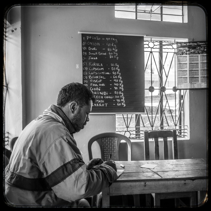 A volunteer writing down a list of groceries. 