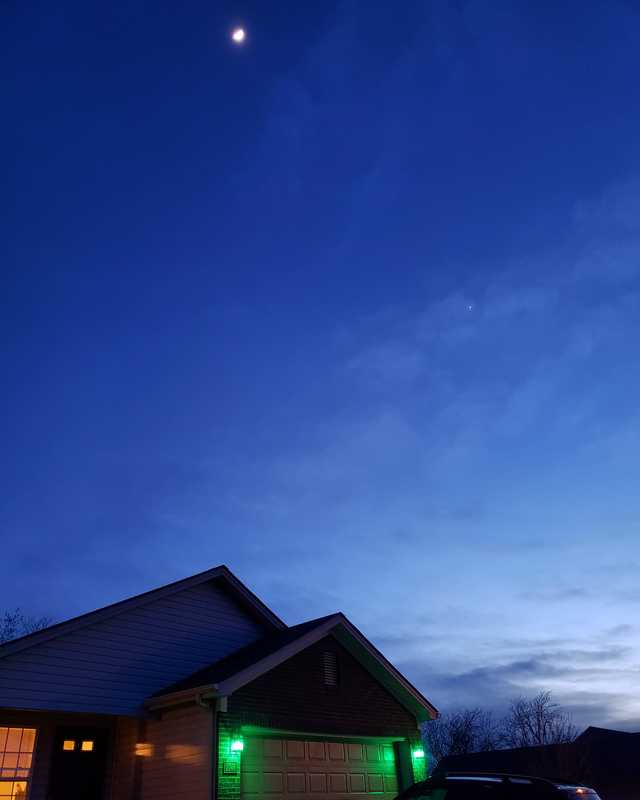 A house with green lights. 