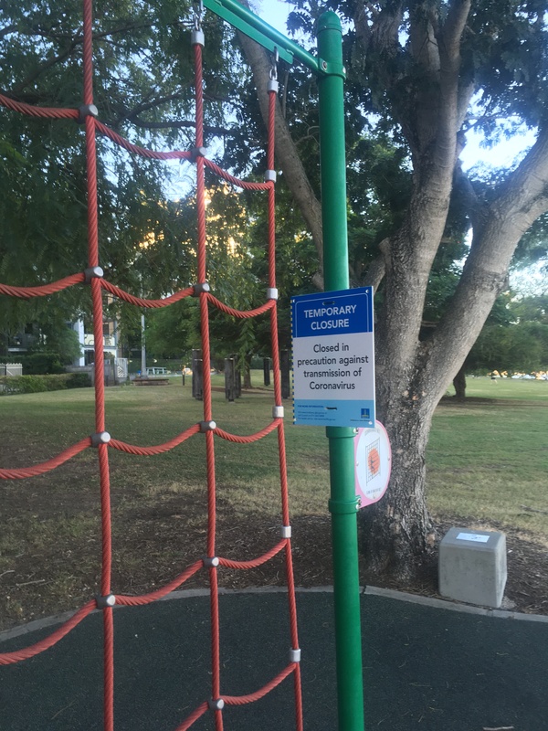 This is a picture of a sign at a park which reads: "Temporary Closure: Closed in precaution against transmission of Coronavirus."