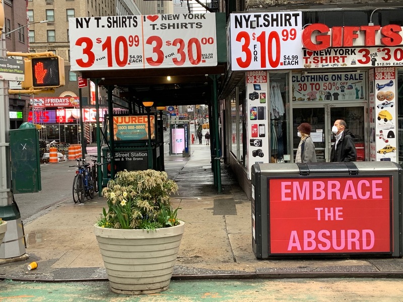 Signs in front of a corner store. 