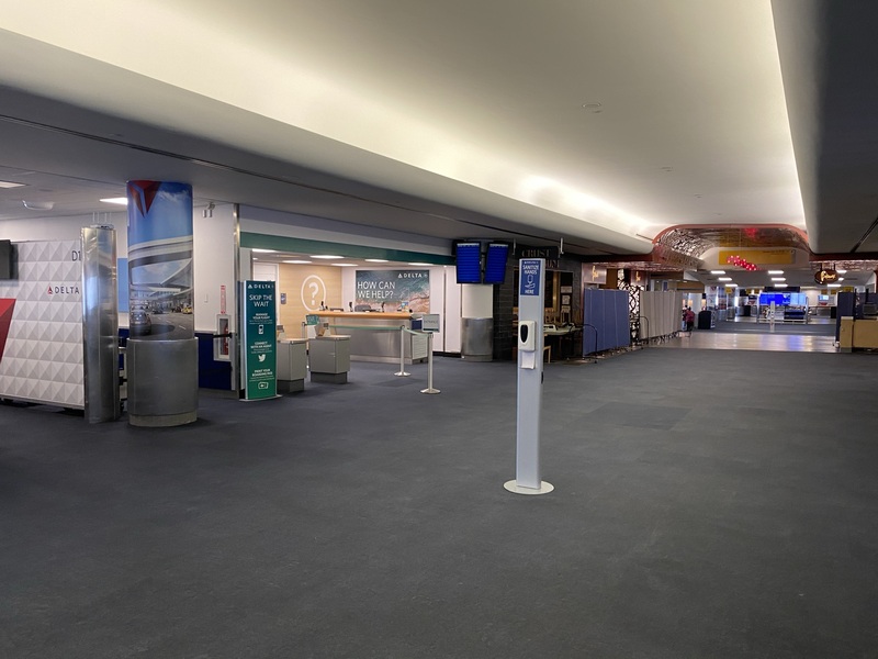 This is a picture taken of a deserted airport terminal. 