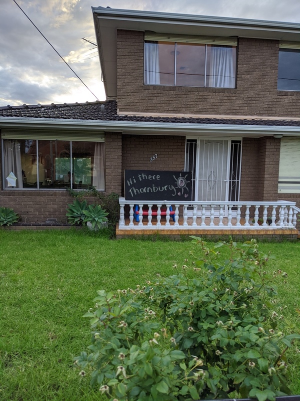 A sign in front of a house. 