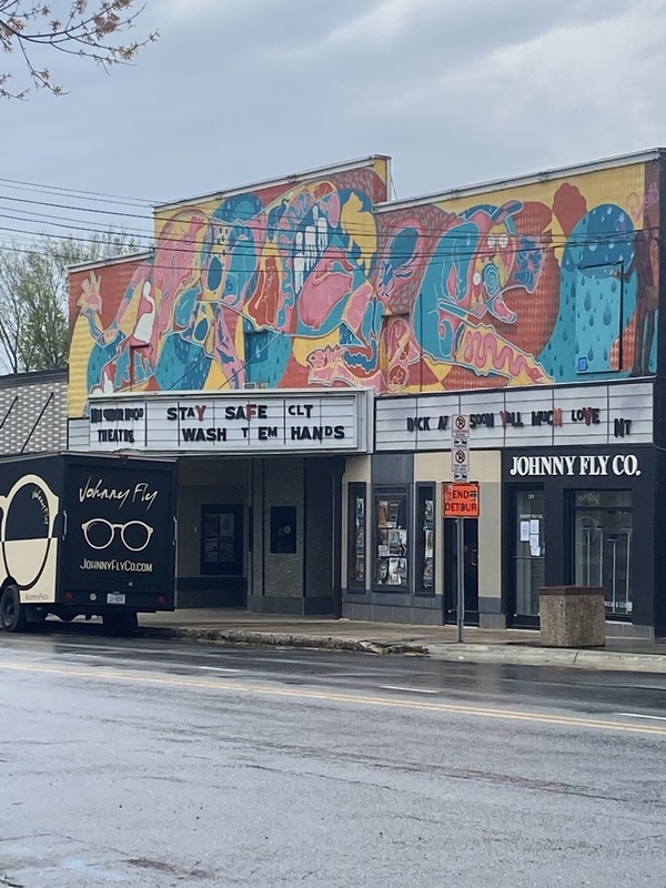 A theater sign that says "stay safe and wash them hands." 