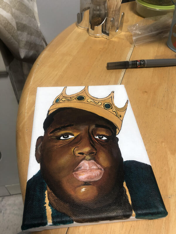 This is a picture of a drawing made of a black man wearing a crown. 