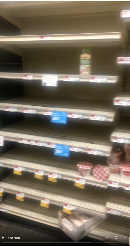 This is a photo of a mostly empty grocery store shelf at the beginning of the COVID-19 pandemic. 