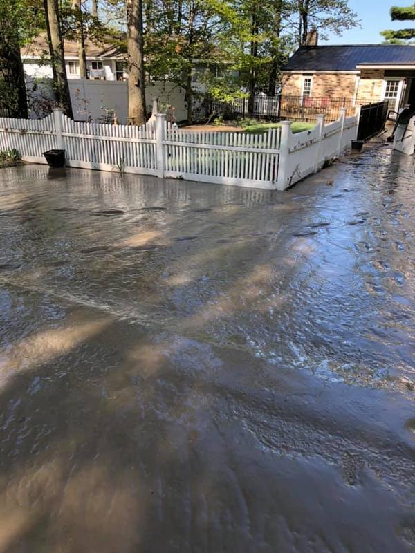 Image of a muddy front yard after a flood.