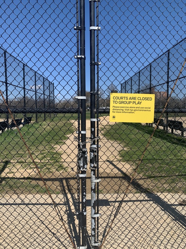 a yellow sign telling people group play and exercise is forbidden only solo play and exercise is allowed