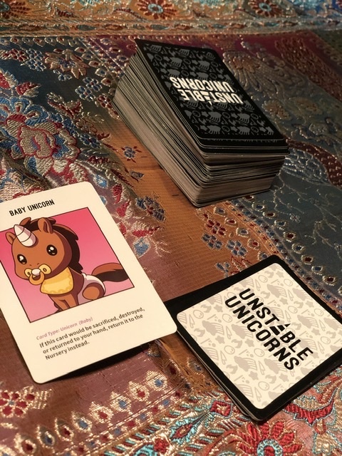 A card game that is called "Unstable Unicorns". 