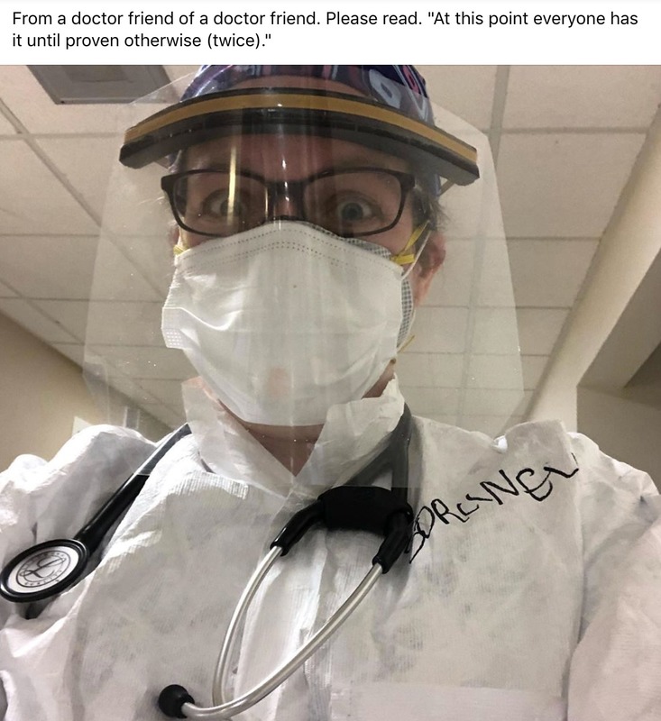 A doctor wearing a mask and protective gear. 