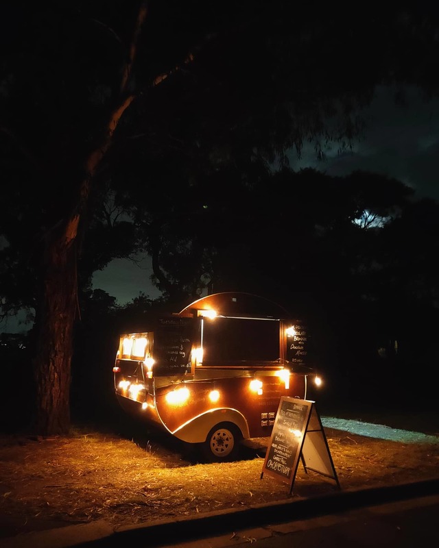 A trailer with lights and signs on it. 