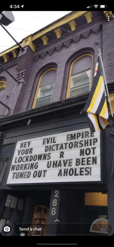 Marquee sign in front of ale house.