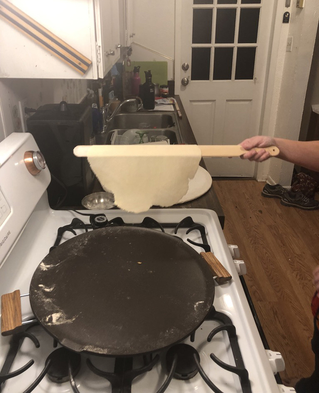 This is a picture taken of freshly rolled dough in a kitchen.