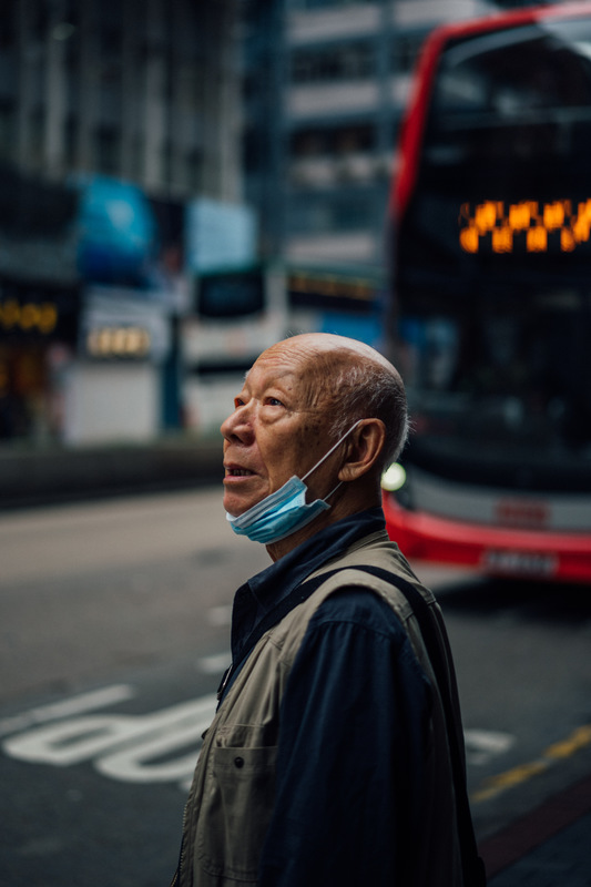 An old person with their mask down. 