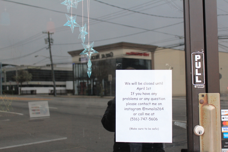 Typed note on a door that says: "We will be closed until April 1st. If you have any problems or any question please contact me on Instagram @nvnails264 or call me at 516-747-5606. Make sure to be safe. 