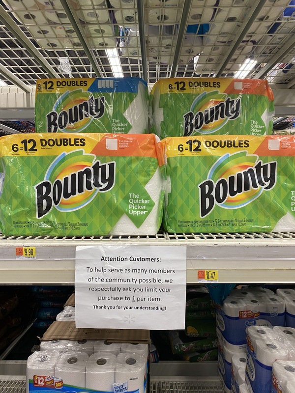 Photo of a paper products aisle at the store with a sign asking customers to only purchase one item.