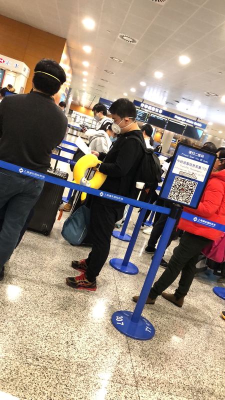 People waiting in line to be Covid tested at an airport. 