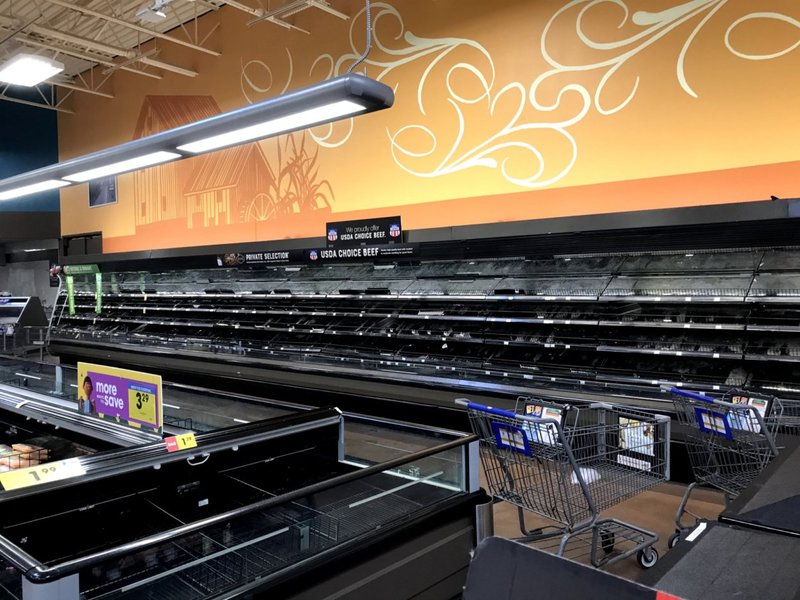 Empty shelves in a grocery store. 