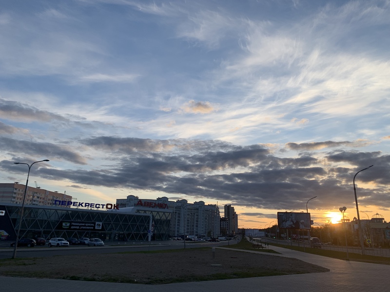 Buildings in front of a setting sun. 