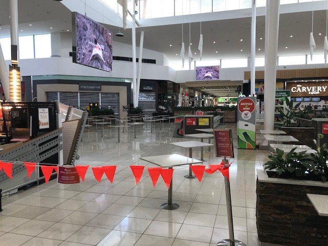 A mall food court that is zoned off. 