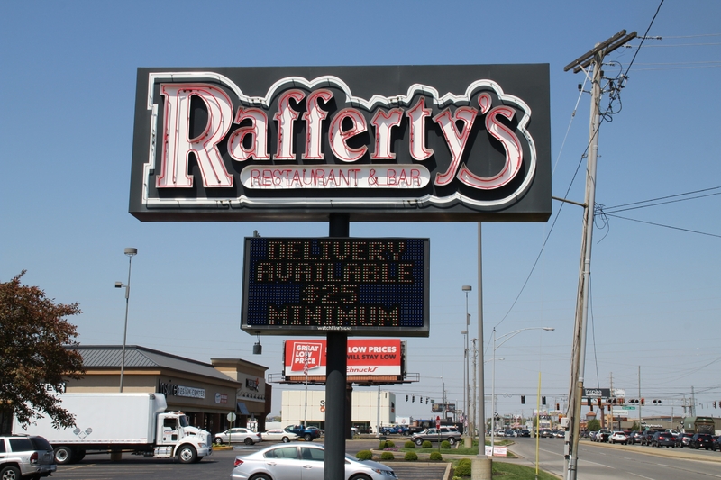 A restaurant sign reading "Delivery Available $25 minimum".