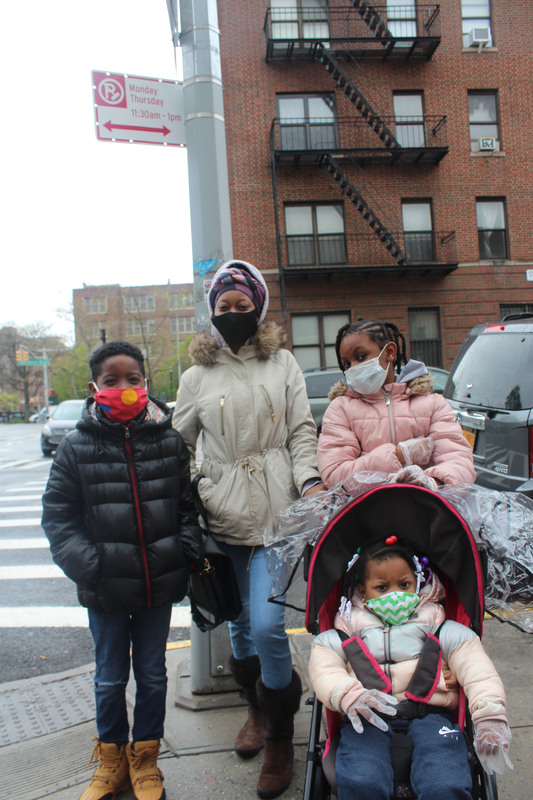 A family with masks on. 