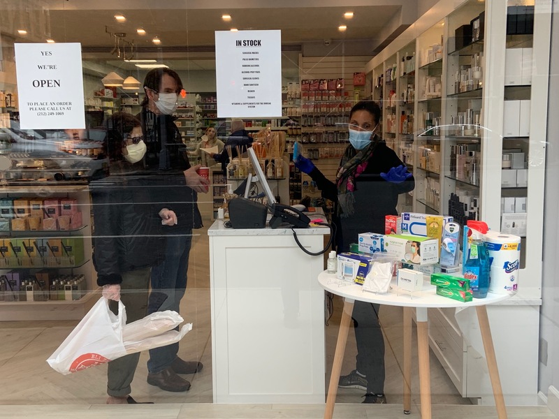 People paying at a cash register. 