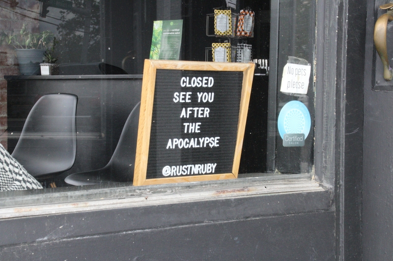 A business sign reading "Closed. See you after the apocalypse". 