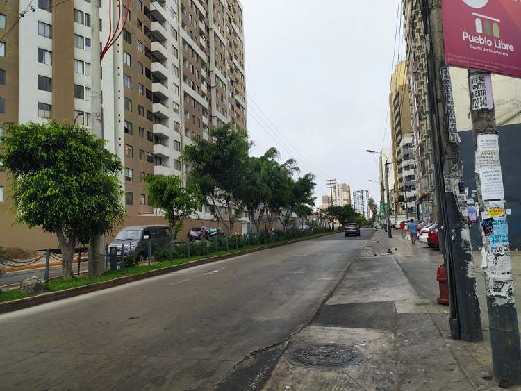 A street that has a few cars on it. 