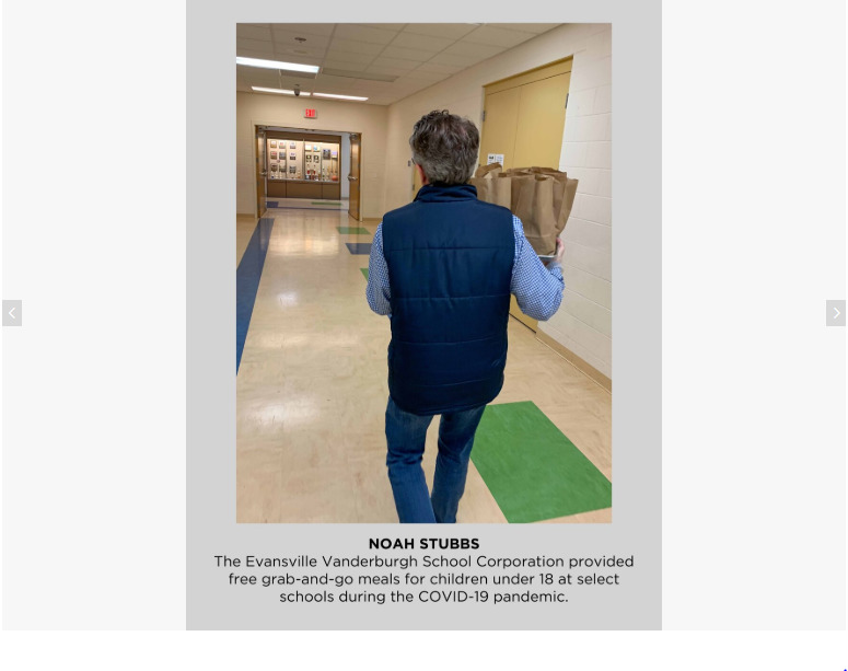 Photo of someone walking down a hallway with brown paper bags.