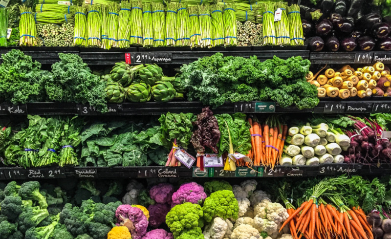 A fully stocked produce section at a grocery store. 