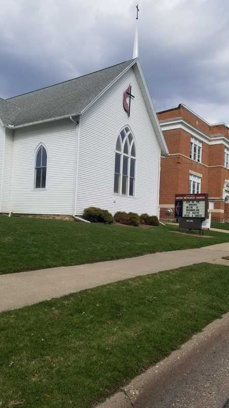 A church with a sign. 