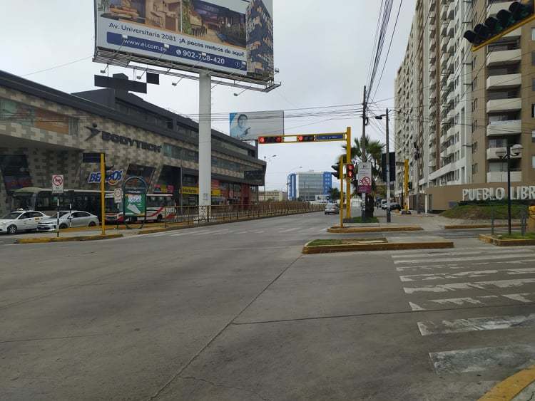 A street that has barely any cars on it. 