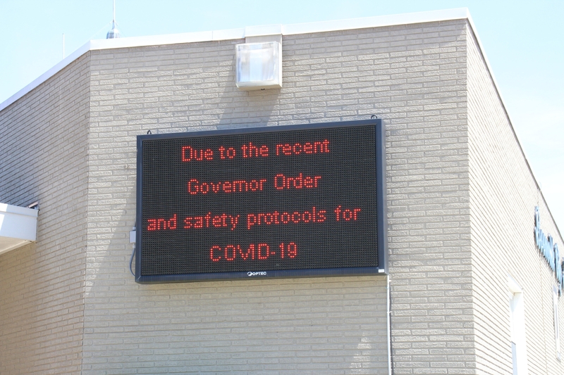 Business sign reading "Due to the recent Governor Order and Safety Protocols for COVID-19".