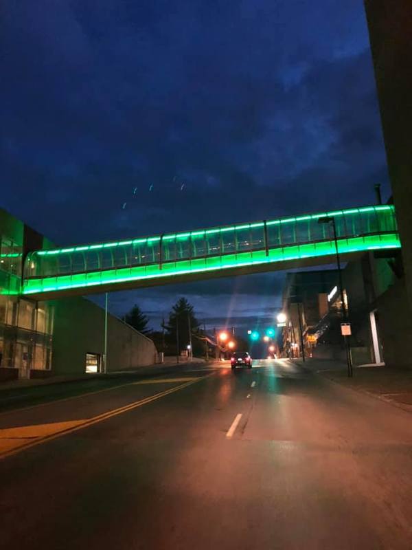 A walkway glowing with green lights. 