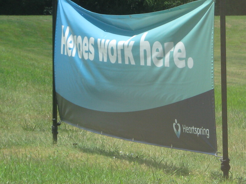 A sign outside of the Heartspring school for special needs children reading Heroes Work Here. 