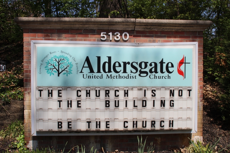 A church sign reading "The Church is Not the Building. Be the Church".