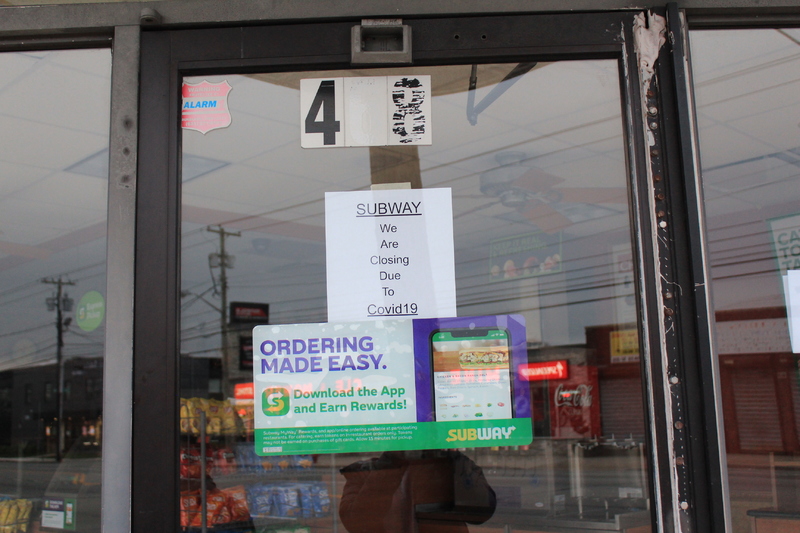 A sign at Subway that says: "We are closed due to Covid-19."