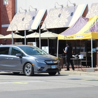 A photo of curbside service at a Panera Bread.